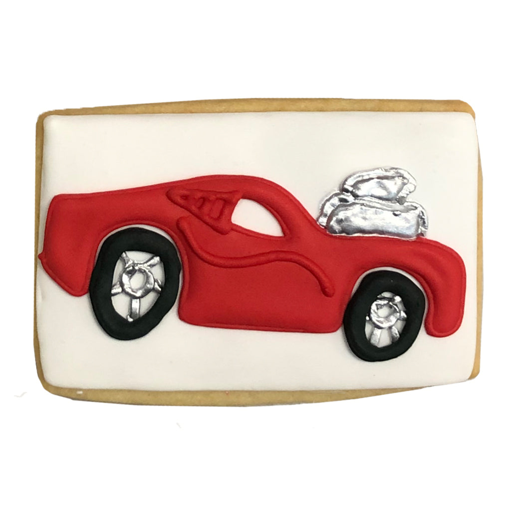 Speed Racer cookie with a red car and silver engine detail.