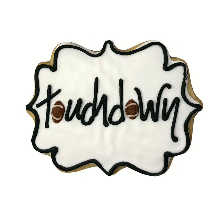 Football cookie with white icing and Touchdown text.