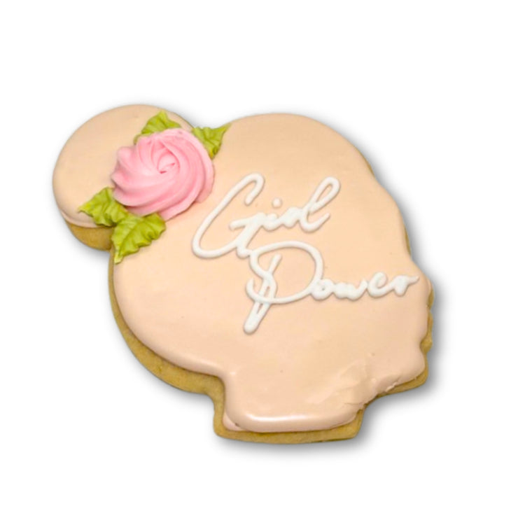 Women's History Month cookie shaped like a head with a rose.