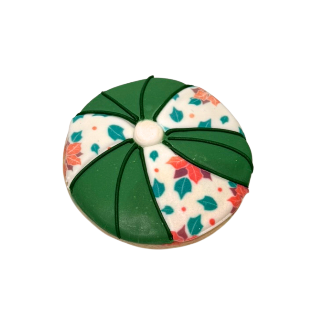 Christmas in July cookie with green and poinsettia icing.