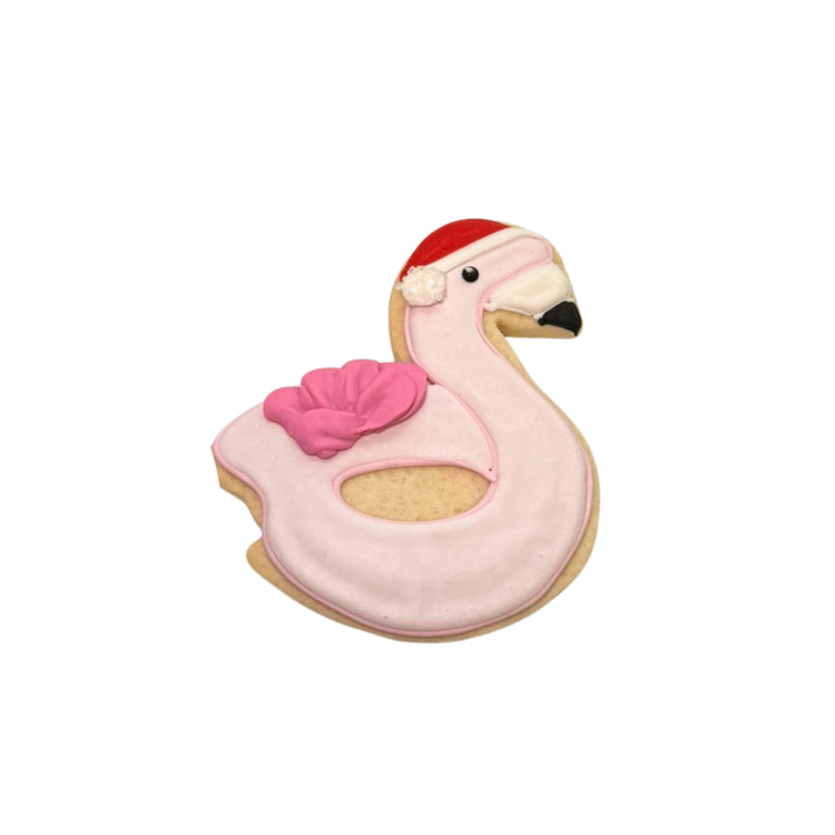 Christmas in July flamingo cookie wearing a Santa hat