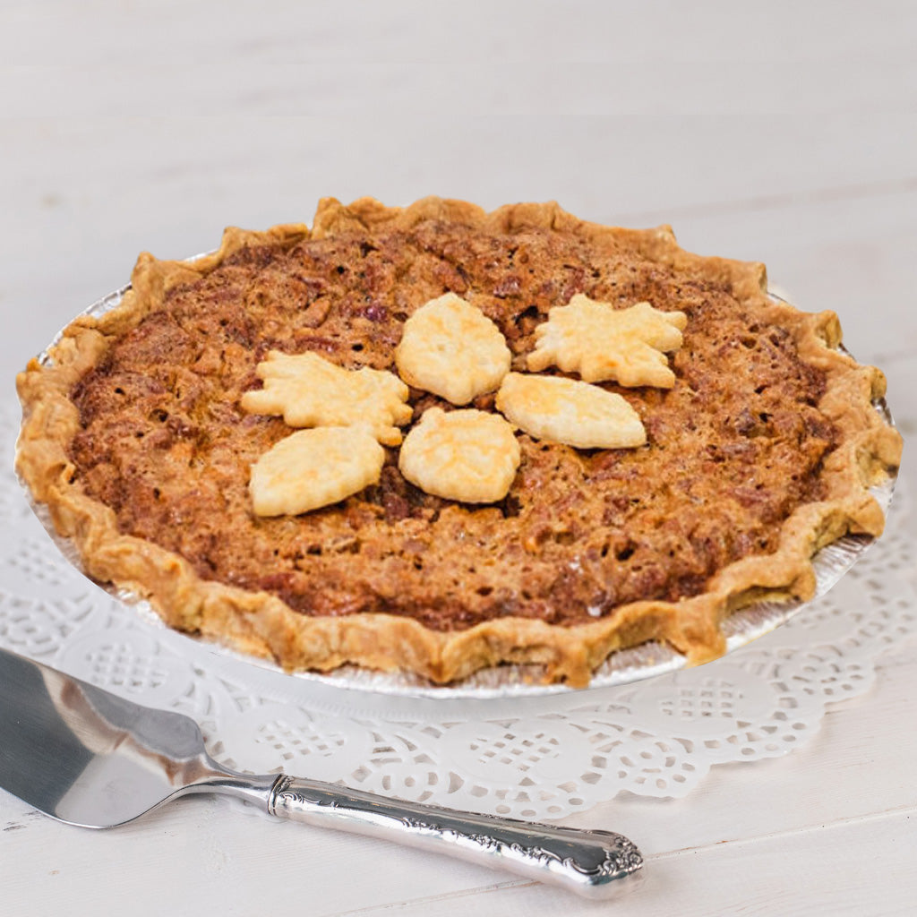 Southern Pecan Pie topped with decorative pastry leaves.
